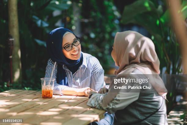 asian malaysian malay friends having conversation at cafe happy - malay people stock pictures, royalty-free photos & images