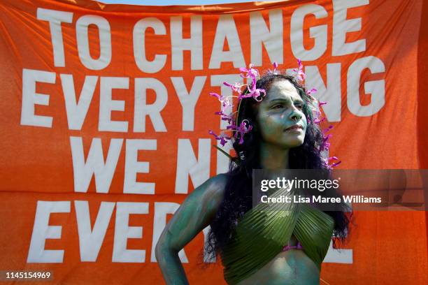 Environment activist stands in costume during a anti Adani Carmichael Coal Mine rally on April 26, 2019 in Airlie Beach, Australia. Former Greens...