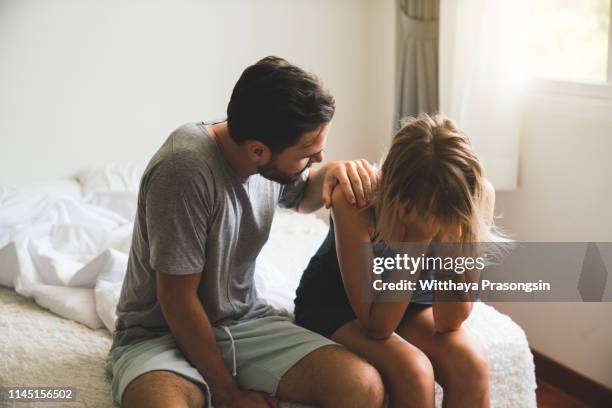 loving husband comfort upset offended wife, caressing and hugging - affari stock pictures, royalty-free photos & images