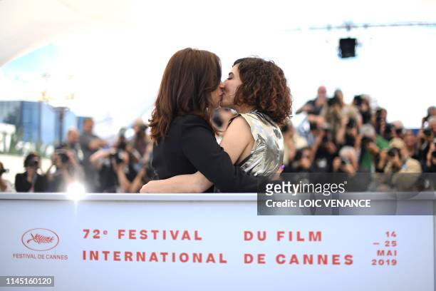 Moroccan actress Nisrin Erradi and Moroccan actress Lubna Azabal kiss during a photocall for the film "Adam" at the 72nd edition of the Cannes Film...