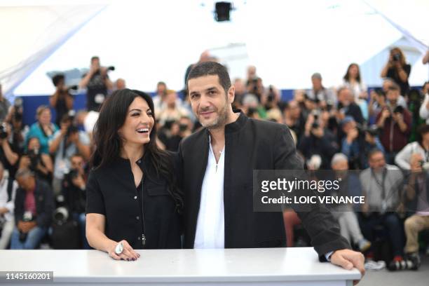 Moroccan film director Maryam Touzani and Moroccan producer Nabil Ayouch pose during a photocall for the film "Adam" at the 72nd edition of the...