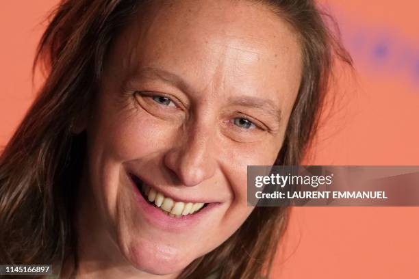 French director Celine Sciamma smiles during a press conference for the film "Portrait Of A Lady On Fire " at the 72nd edition of the Cannes Film...