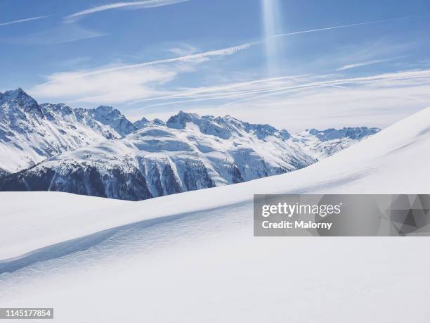 panoramic view of snowcapped mountain range. - winter sport stock pictures, royalty-free photos & images