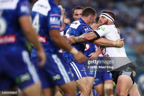 Josh McGuire of the Cowboys is tackled during the round 7 NRL match between the Canterbury Bulldogs and the North Queensland Cowboys at ANZ Stadium...