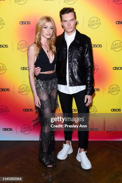 Katherine McNamara and Luke Baines attend ASOS celebrates partnership with Life Is Beautiful at No Name on April 25, 2019 in Los Angeles, California.