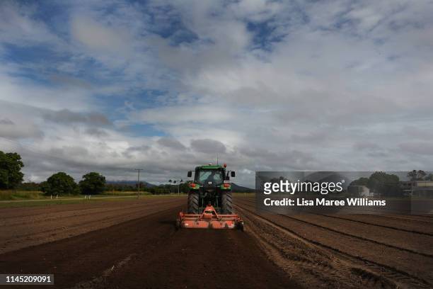 Farm hand prepares soil for crops on Walker Farms on April 24, 2019 in Bowen, Australia. Bowen, population just over 10 is located on the coast of...