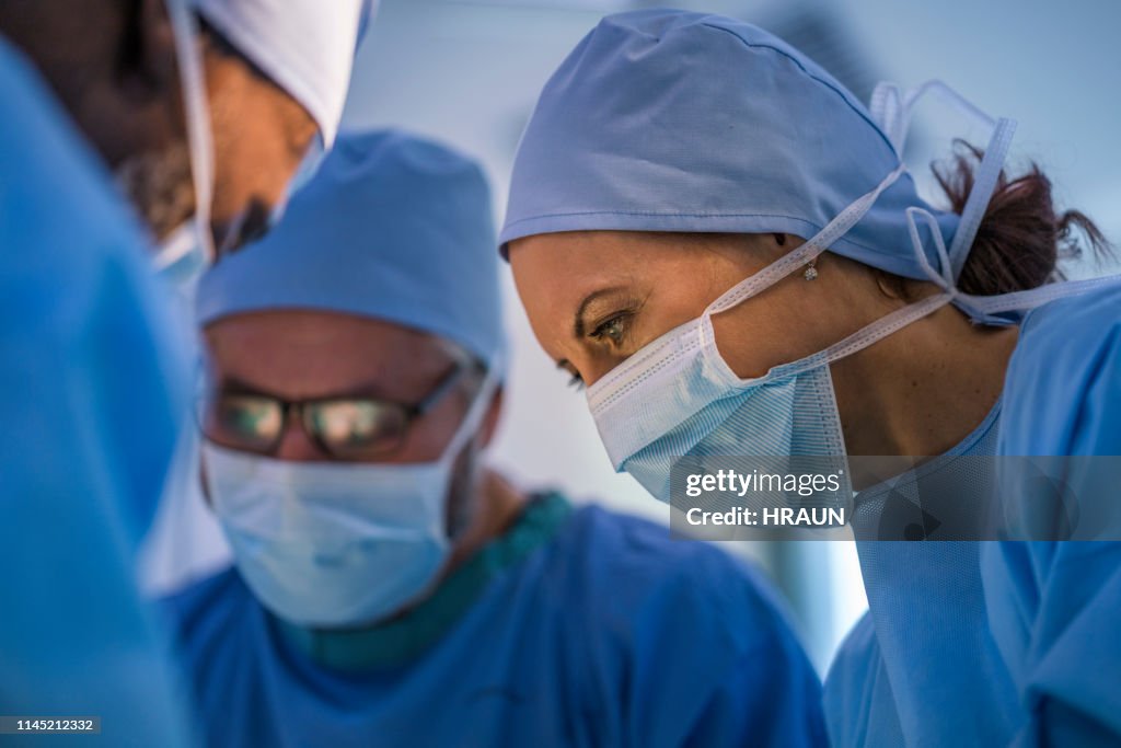Confident surgeons operating in emergency room