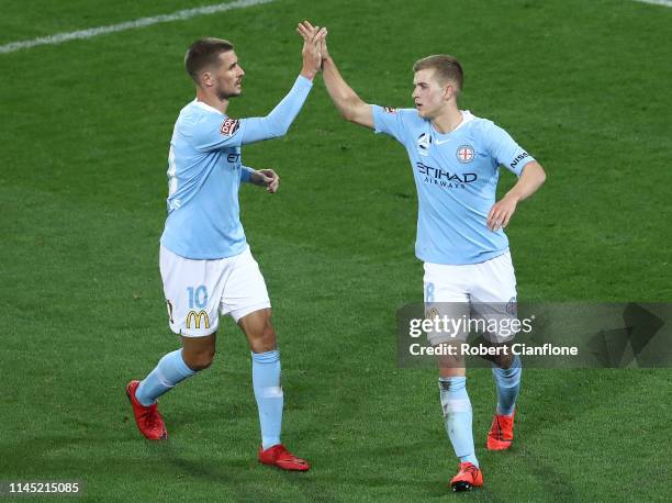 Riley McGree of the Melbourne City celebrates with Dario Vidosic after scoring a goal during the round 27 A-League match between Melbourne City and...