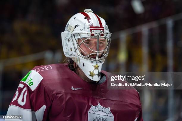 Goalie Kristers Gudlevskis of Latvia looks on during the 2019 IIHF Ice Hockey World Championship Slovakia group game between Sweden and Latvia at...