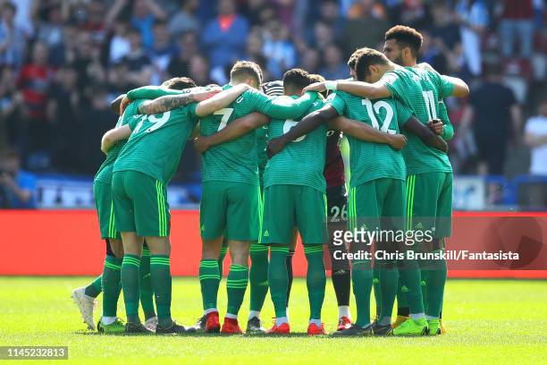Watford huddle together ahead of the Premier League match between Huddersfield Town and Watford FC at John Smith's Stadium on April 20, 2019 in...