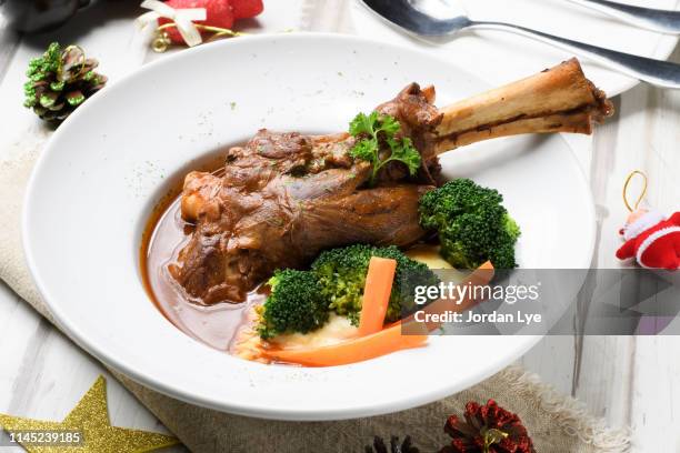 braised lamb shank - lamb shank stock pictures, royalty-free photos & images