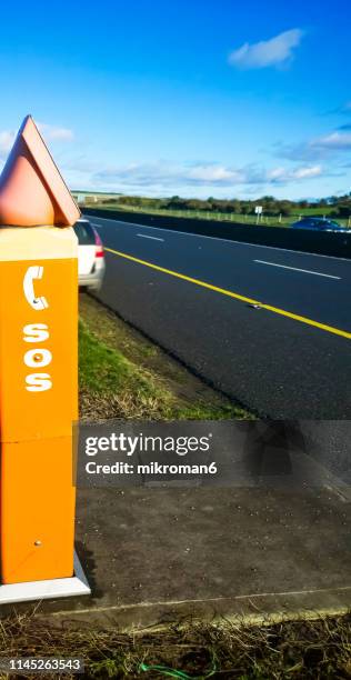 sos emergency road telephone box - emergency telephone box stock pictures, royalty-free photos & images