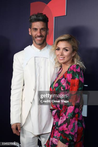 Mexican Actor Erick Elias and his guest pose during the Red Carpet at the official after party of the 2019 Billboard Latin Music Awards at the...