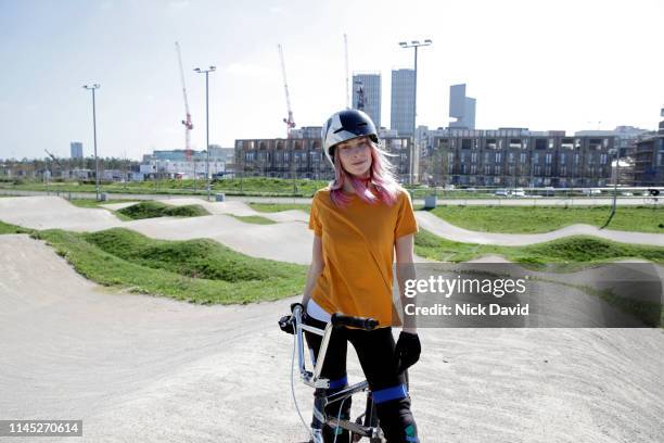 portrait of female cyclist on race track with bmx - olympic park venue stock-fotos und bilder