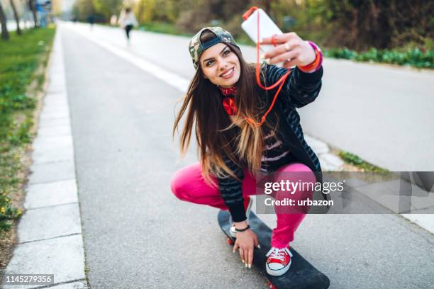 skater girl making selfies - extreme skating stock pictures, royalty-free photos & images