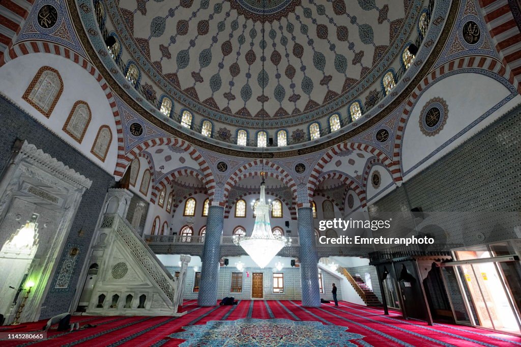 Interior view of Dergah mosque with praying people in Şanlıurfa.