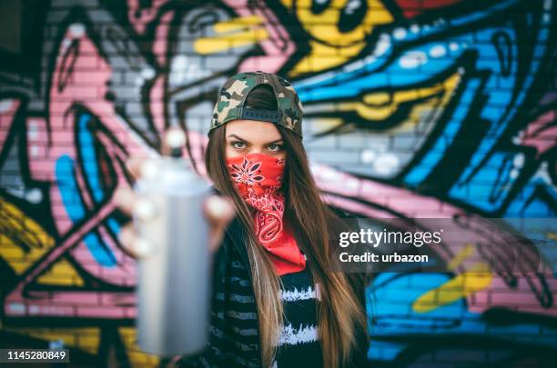 graffiti artist with spray paint - graffiti artists stock pictures, royalty-free photos & images