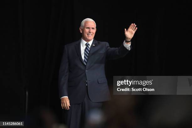 Vice President Mike Pence waves to guests at the NRA-ILA Leadership Forum at the 148th NRA Annual Meetings & Exhibits on April 26, 2019 in...