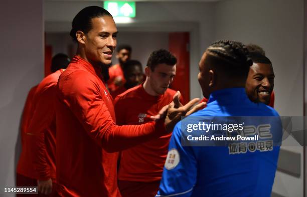 Virgil van Dijk of Liverpool with a Huddersfield player before the Premier League match between Liverpool FC and Huddersfield Town at Anfield on...
