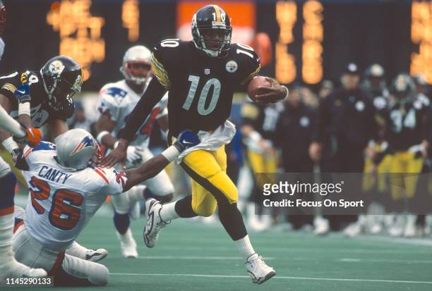 Kordell Stewart of the Pittsburgh Steelers fights off the tackle of Chris Canty of the New England Patriots during the AFC Divisional Playoffs on...