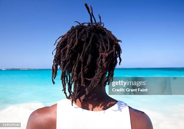 bahamian man looking out to sea. - dreadlocks stock pictures, royalty-free photos & images