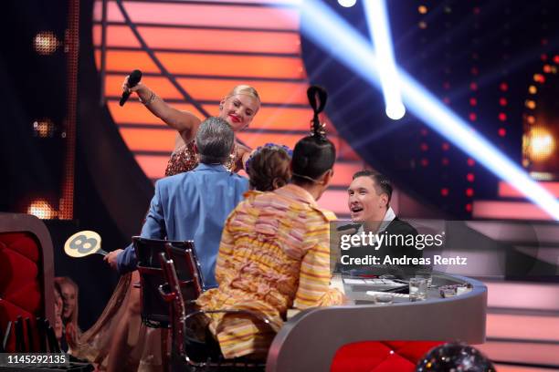 Evelyn Burdecki and Evgeny Vinokurov are seen on stage during the 5th show of the 12th season of the television competition "Let's Dance" on April...