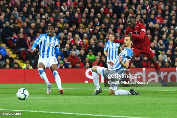 Naby Keita of Liverpool scores his team's first goal during the Premier League match between Liverpool FC and Huddersfield Town at Anfield on April...