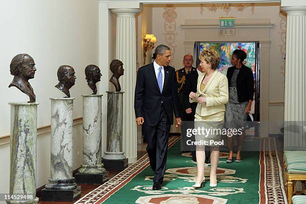 President Barack Obama and Irish President Mary McAleese speak while walking through the Francini corridor in Aras an Uachtarain, the official...