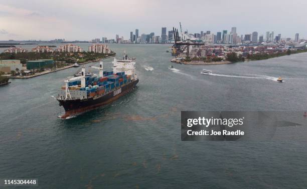 An aerial view from a drone shows the Seaboard Marine cargo ship leaving PortMiami on the day that the Bureau of Economic Analysis announced that the...
