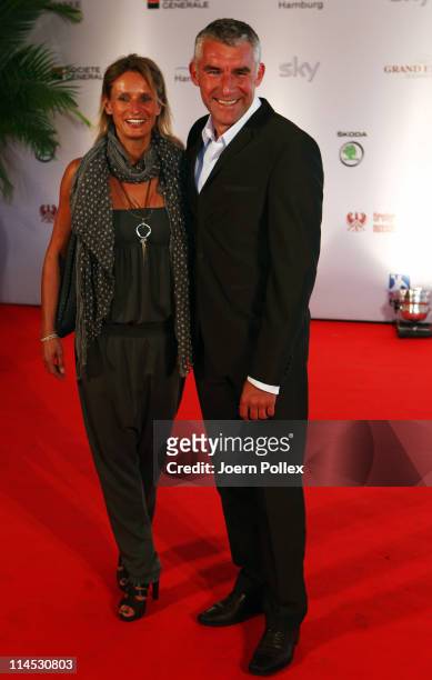 Mirko Slomka and his wife arrive for the Herbert Award 2011 Gala at the Elysee Hotel on May 23, 2011 in Hamburg, Germany.