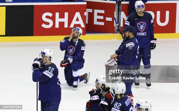 Captain Damien Fleury of France reacts with teammates after being defeated in the 2019 IIHF Ice Hockey World Championship Slovakia group A game...