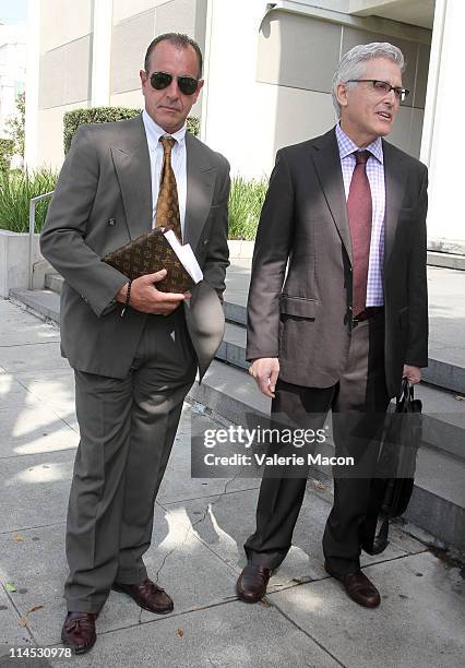 Michael Lohan and his lawyer leave the Beverly Hills courthouse for his arraignment on May 23, 2011 in Beverly Hills, California.