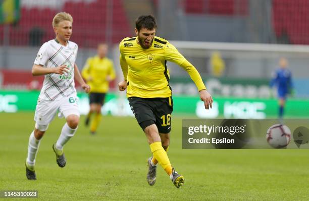 Danil Stepanov of FC Rubin Kazan and Apti Akhyadov of FC Anji Makhachkala vies for the ball during the Russian Football League match between FC Rubin...