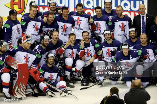 British players celebrate the victory after the 2019 IIHF Ice Hockey World Championship Slovakia group A game between France and Great Britain at...