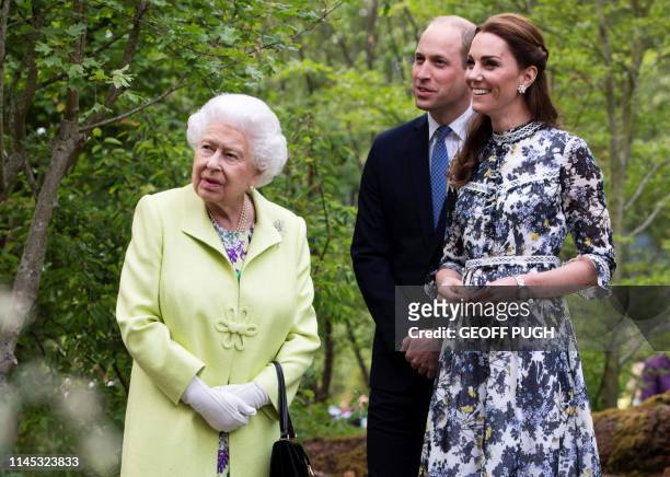 Britain's Catherine, Duchess of Cambridge shows Britain's Queen Elizabeth II and Britain's Prince William, Duke of Cambridge, around the 'Back to...