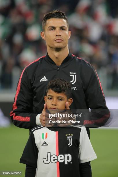 Cristiano Ronaldo of Juventus FC and Cristiano Ronaldo jr. Looks on before the serie A match between Juventus FC and Atalanta BC at Allianz Stadium...