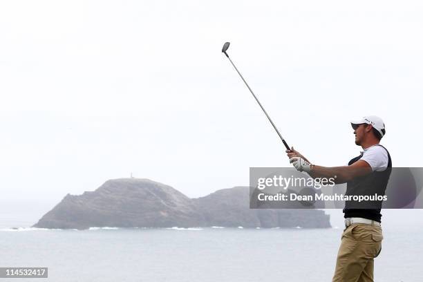 Lloyd Saltman of Scotland hits his tee shot on the 14th hole during the final day of the Madeira Islands Open on May 22, 2011 in Porto Santo Island,...