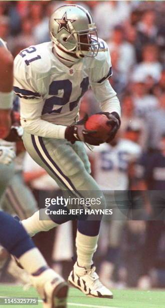 Deion Sanders of the Dallas Cowboys takes a reverse during the NFC Championship Game against the Green Bay Packers 14 January. Sanders, who plays...