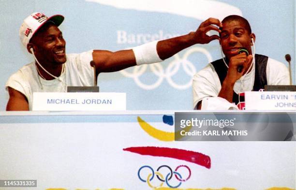 Basketball stars Michael Jordan and Earvin "Magic" Johnson clown for the media 25 July during a press conference for the U.S. Olympic "Dream Team."...