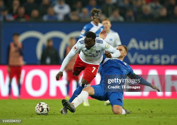 Khaled Narey of Hamburger SV and Jan Kirchhoff of 1. FC Magdeburg battle for the ball during the Second Bundesliga match between Hamburger SV and 1....