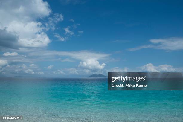 Blue sky with clouds view towards the island of Atokos at Gidaki beach near Vathy, Ithaca, Greece. Ithaca, Ithaki or Ithaka is a Greek island located...