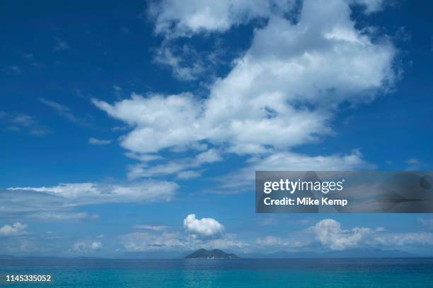 Blue sky with clouds view towards the island of Atokos at Gidaki beach near Vathy, Ithaca, Greece. Ithaca, Ithaki or Ithaka is a Greek island located...