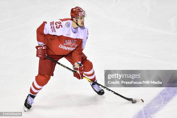 Oliver Lauridsen of Denmark controls the puck during the 2019 IIHF Ice Hockey World Championship Slovakia group A game between Slovakia and Denmark...