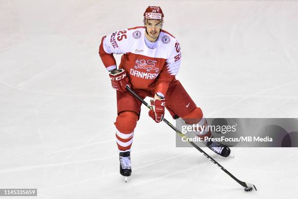 Oliver Lauridsen of Denmark controls the puck during the 2019 IIHF Ice Hockey World Championship Slovakia group A game between Slovakia and Denmark...