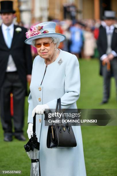 Britain's Queen Elizabeth II attends the Garden Party at Buckingham Palace in central London on May 21, 2019.