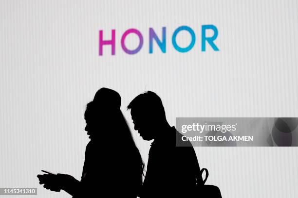 Delegates and members of the media attend a launch event of Honor 20 Series smartphones at Battersea Evolution in London on May 21, 2019.