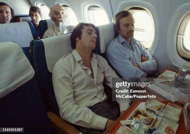 Trevor Francis and Mick Mills of England sleeping during the flight home the day after the 2-0 win against Spain at the Camp Nou on March 27, 1980 in...