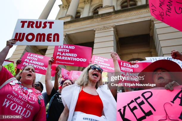 People protest against Georgia's recently passed "heartbeat" bill at the Georgia State Capitol building, on May 21, 2019 in Atlanta, Georgia. The...