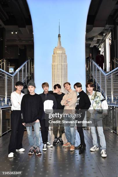 Suga, Jin, Jungkook, RM, Jimin, and J-Hope of the K-Pop Group BTS visit The Empire State Building on May 21, 2019 in New York City.