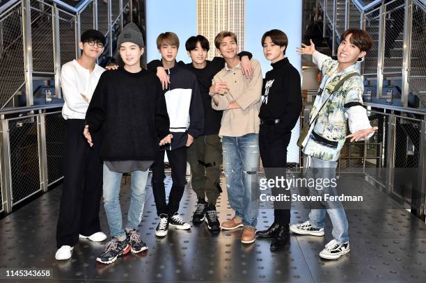 Suga, Jin, Jungkook, RM, Jimin, and J-Hope of the K-Pop Group BTS visit The Empire State Building on May 21, 2019 in New York City.